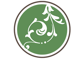 The don area logo, green circle with white floral pattern